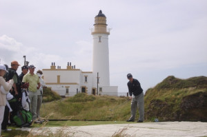 Tom Watson teeing off in front of the Lighthouse at Turnberry.