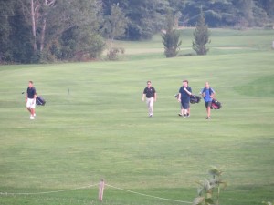 Coach Matt, a Sen Foley look-a-like, with his junior golfers on the Cronin golf course.