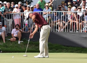 Adam Scott putting in the 7-hole playoff loss to Greg Chalmers at the Australian PGA Championship. Note the guy with the camera in the background. Photo Credit: Bruce Young.